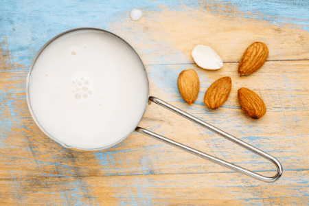 Can you freeze almond milk? A measuring cup full of almond milk